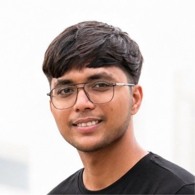 Jaivik smiling in a black tee