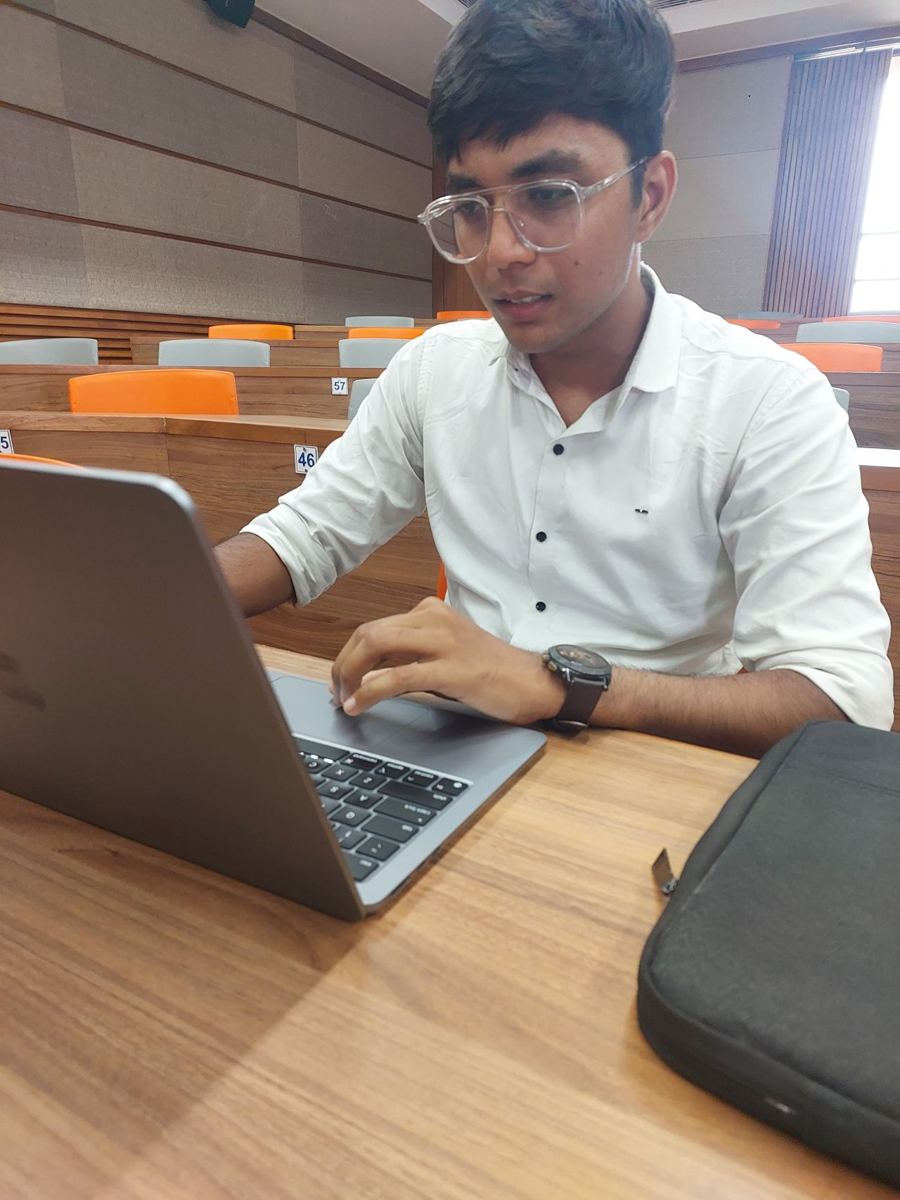 Working at my desk in a Nirma classroom